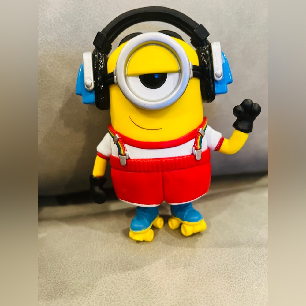 Despicable me figure Tim rollerskating with head phones.
